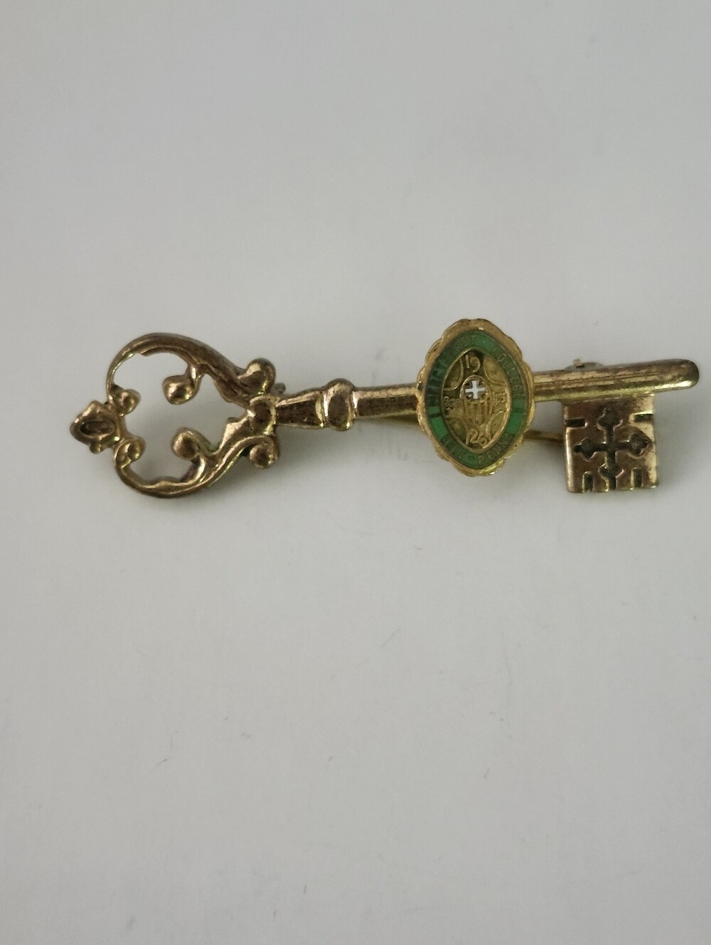 Vintage-Style Gold Tone Key Brooch with Green Enamel & Cross Accent